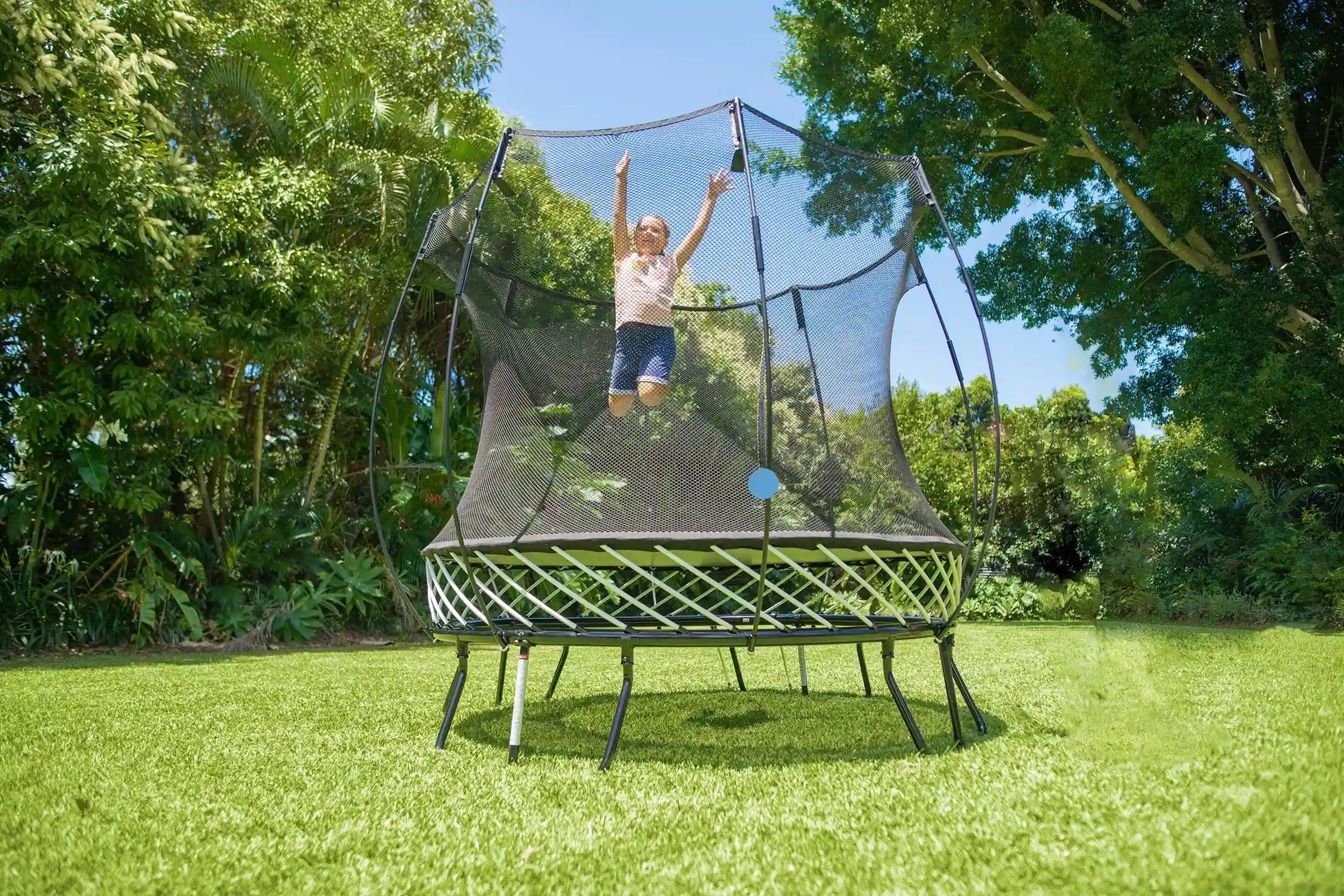 girl jumping high on a trampoline