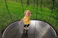 Load image into Gallery viewer, girl jumping on a huge trampoline
