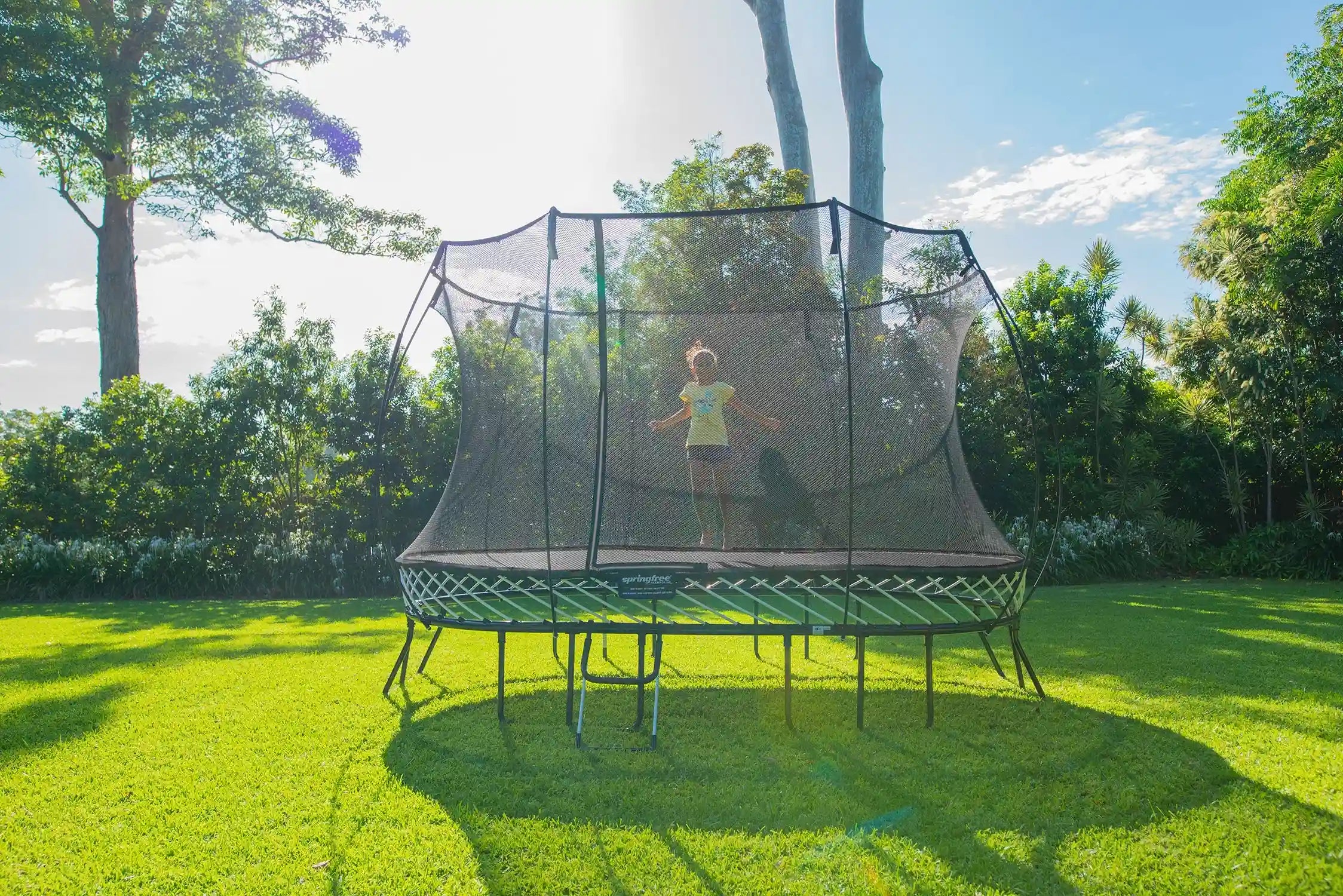 girl playing on a trampoline