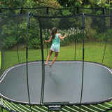 Load image into Gallery viewer, girl jumping on a large trampoline
