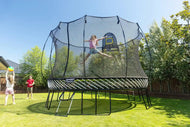 Load image into Gallery viewer, a girl jumping high on an outdoor trampoline
